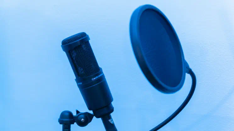 Microphone against blue background